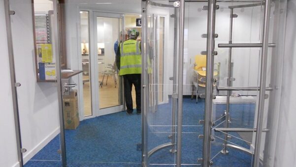 Glass entrance turnstiles with wide pedestrian access gate