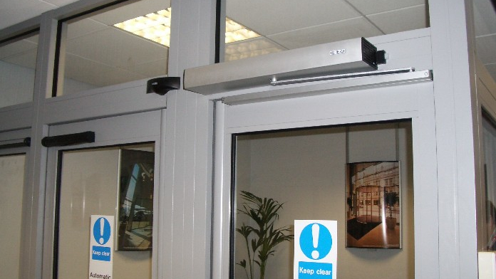 Automatic door opener on glass entrance door