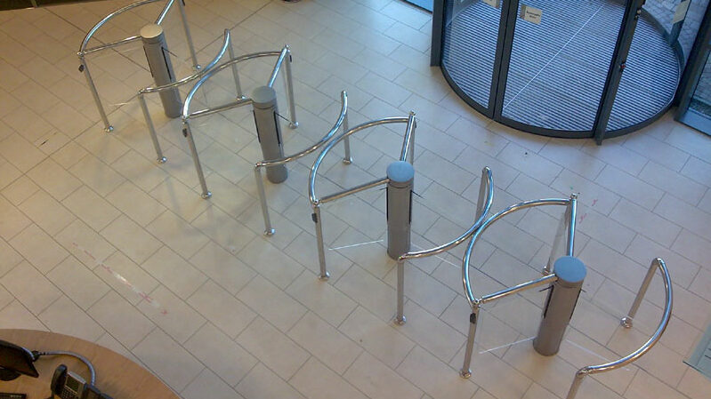 Row of rotary glass turnstiles