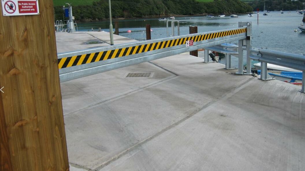 Heavy duty automatic sliding barrier in closed position across the entrance to a car park