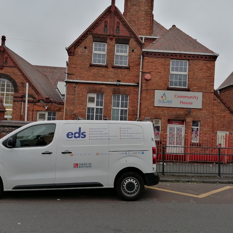 Photo of EDS van outside automatic sliding gate at Shawhill School