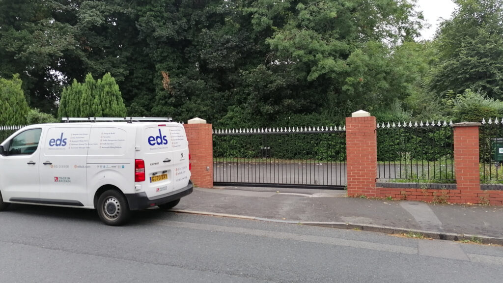 Photo of EDSUK van in front of automatic sliding gate installed at Edgbaston Dental Centre