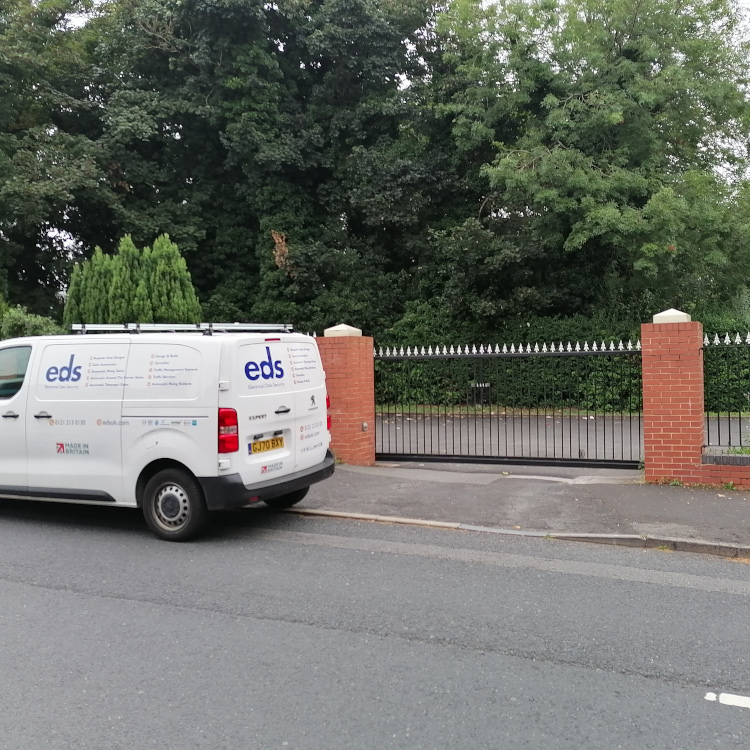 Photo of EDSUK van in front of automatic sliding gate installed at Edgbaston Dental Surgery