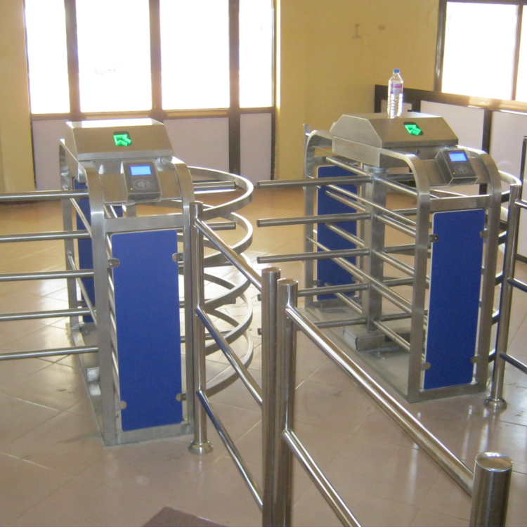 Photo of three quarter height turnstiles with indicator light panels and RFID readers