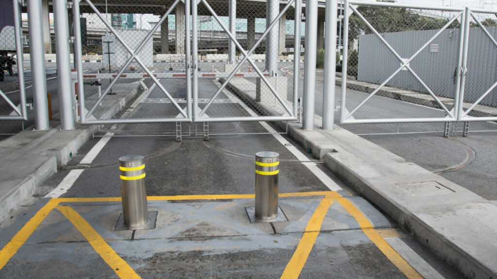 Automatic crash rated bollards in front of a loading bay