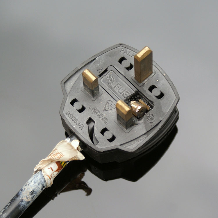 Electric plug with broken fuse