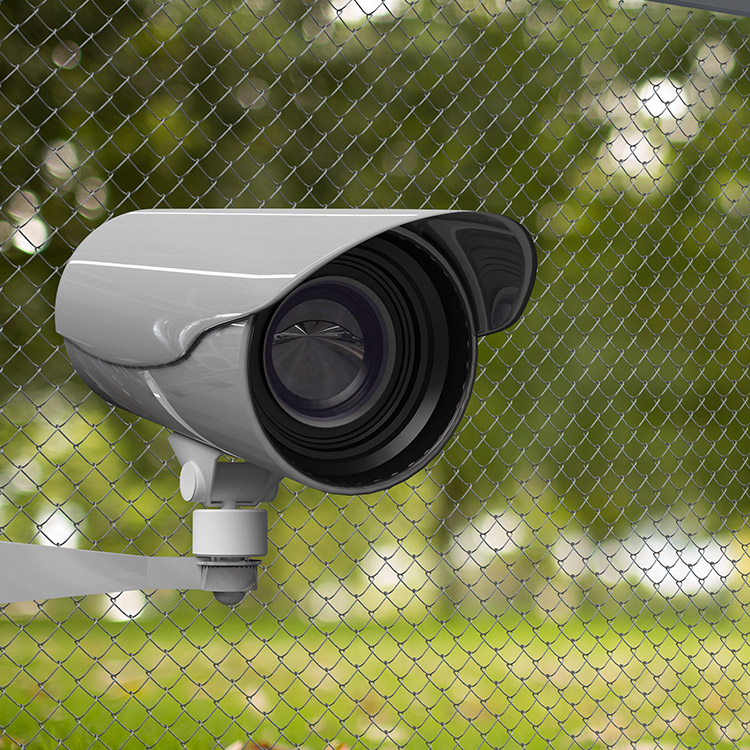 Photo of high security CCTV camera mounted next to fence