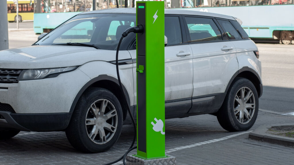 Electric car charging point in use