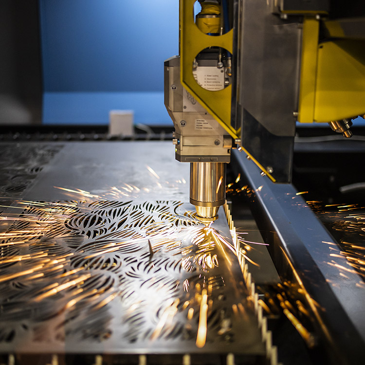 Photo of a CNC machine working on an ornate design