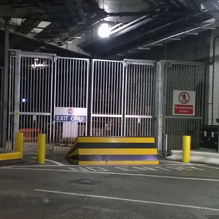 Rising kerb blocker in front of high security gates