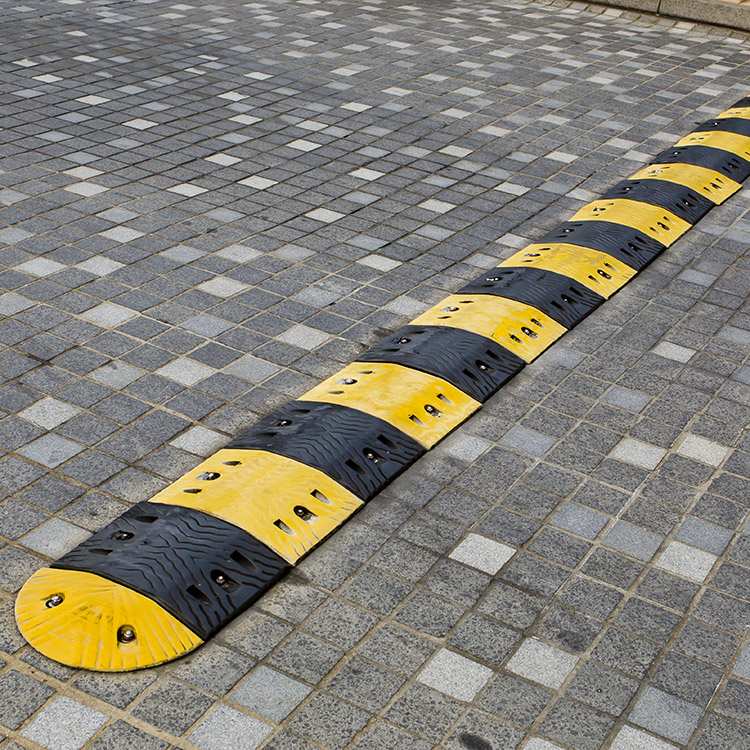 Photo of black and yellow PVC speed bump ramp